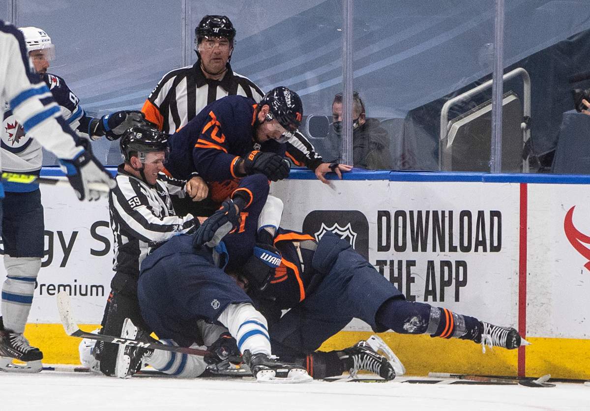 Edmonton Oilers and the Winnipeg Jets players rough it up during second period NHL Stanley Cup playoff action in Edmonton on Friday, May 21, 2021.THE CANADIAN PRESS/Jason Franson.
