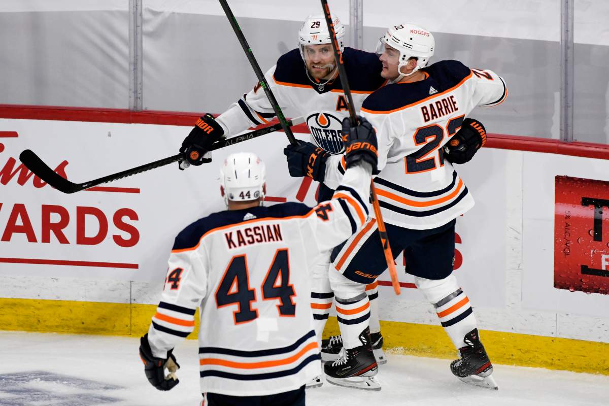 Edmonton Oilers’ Leon Draisaitl (29) celebrates his first goal with Zack Kassian (44) and Darnell Nurse (25) during first period NHL Stanley Cup playoff action against the Winnipeg Jets, in Winnipeg on Sunday, May 23, 2021.