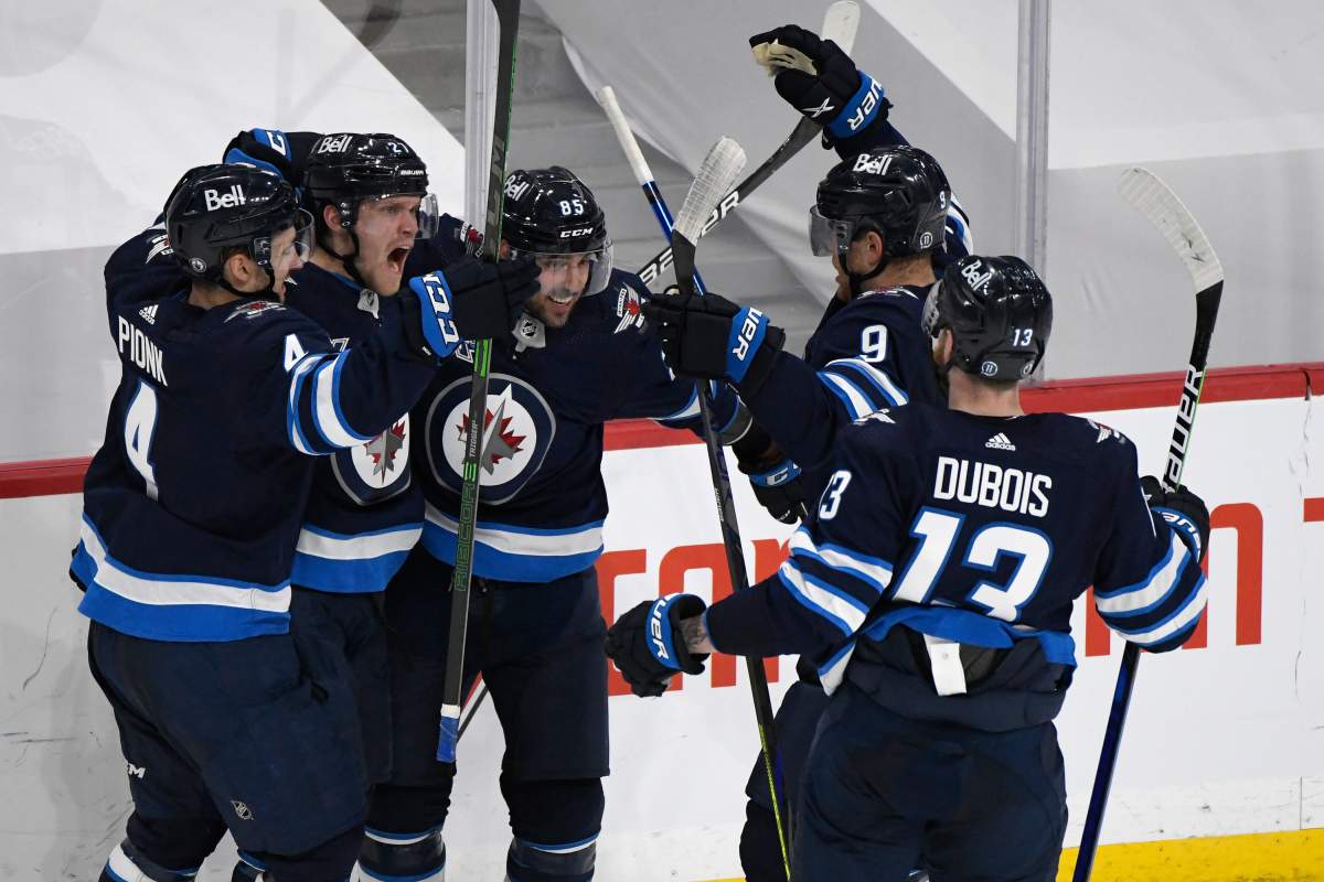 Winnipeg Jets' Nikolaj Ehlers (27) celebrates his goal with teammates during second period NHL Stanley Cup playoff action against the Edmonton Oilers, in Winnipeg on Sunday, May 23, 2021.
