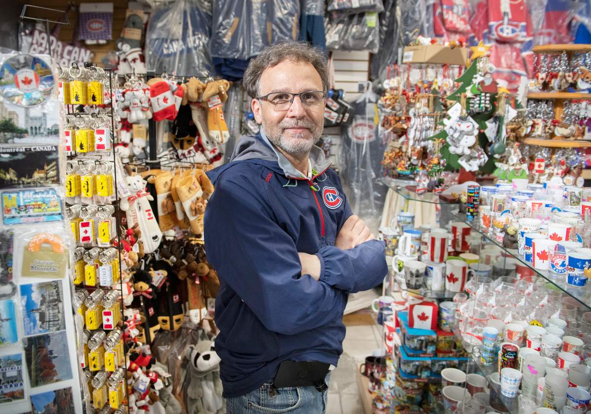 Mohamed Ghodhbane, owner of Noor Souvenirs, poses at his store in Old Montreal, Monday, May 24, 2021. 