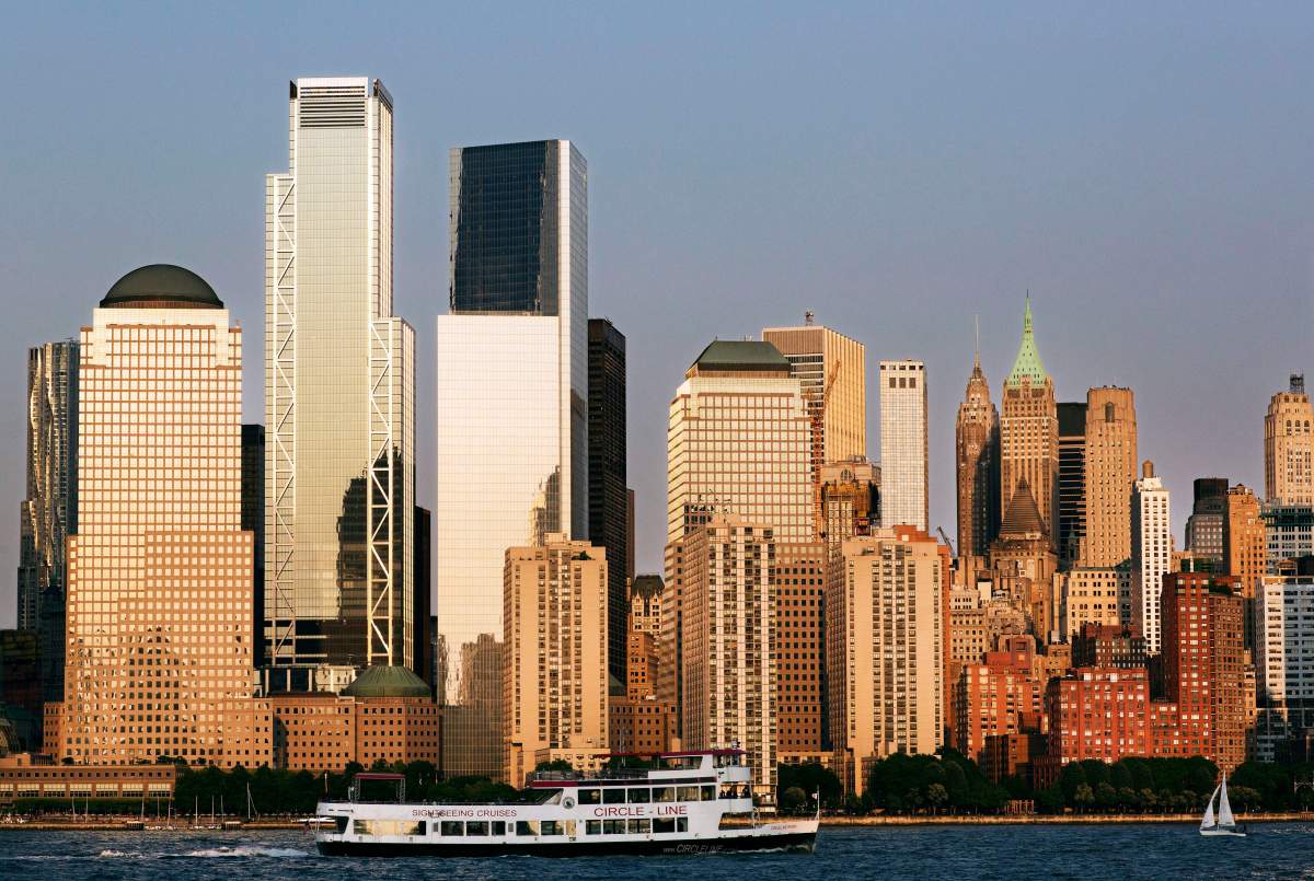 In this June 7, 2018 photo, a tour boat on the Hudson River passes 3 World Trade Center, second from left, and the lower Manhattan skyline.