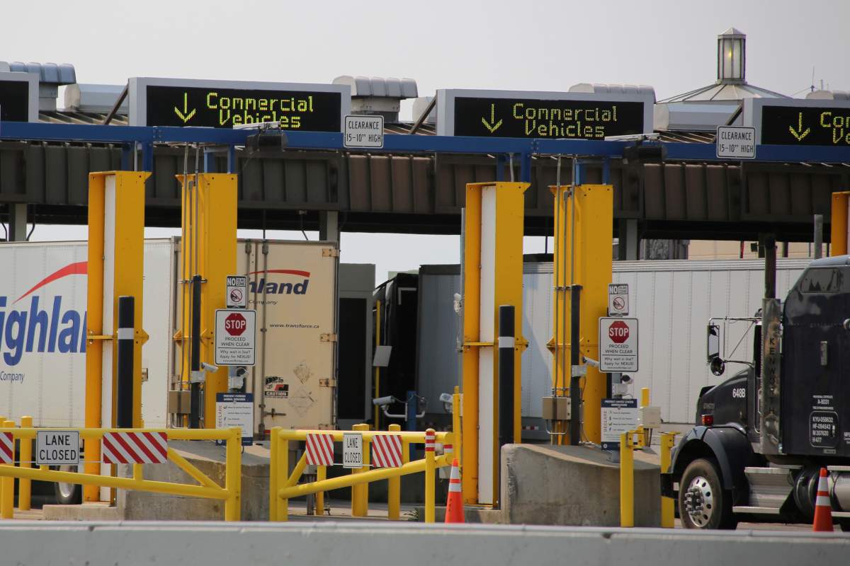 Trucks enter the U.S. from Canada on the Peace Bridge, Tuesday, Sept. 22, 2020, in Buffalo N.Y.