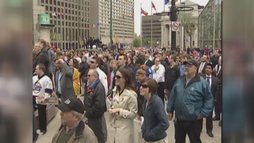 A large crowd gathered at Portage and Main, watching the announcement, on May 31, 2011.
