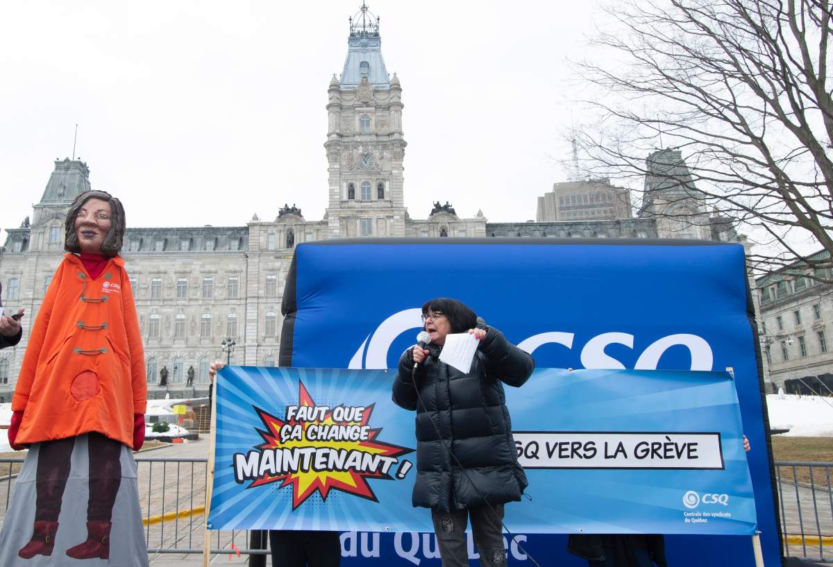 CSQ Teacher's union president Sonia Ethier calls on protestors at a demonstration, Thursday, March 18, 2021 at the legislature in Quebec City.  Ethier announced a strike in some 30 Cegep college for March 30.