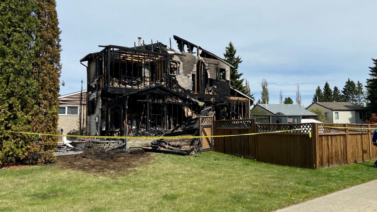 RCMP investigate whether a house fire and shooting in Devon, Alta., are connected, Sunday, May 23, 2021. 