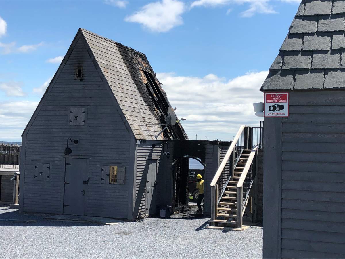 Fire tore through the roof of one of the two interpretation centre buildings at Fort La Tour in Saint John, N.B., on May 19, 2021.