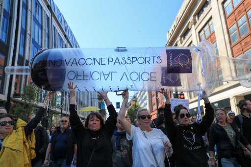 Protesters march in London, U.K., on April 24, 2021 against vaccine passports, face masks and lockdown. The U.K. government aims to provide official proof of vaccination for millions of British holidaymakers this summer starting as early as May 17.