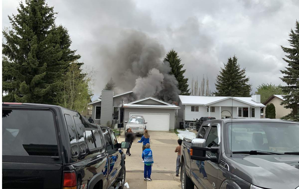Multiple Daly Grove residents sprang into action, calling 911 and teaming up to help save a father and his children trapped in the basement of a home on 35 Street, near 18 Avenue on Wednesday, May 19, 2021.
