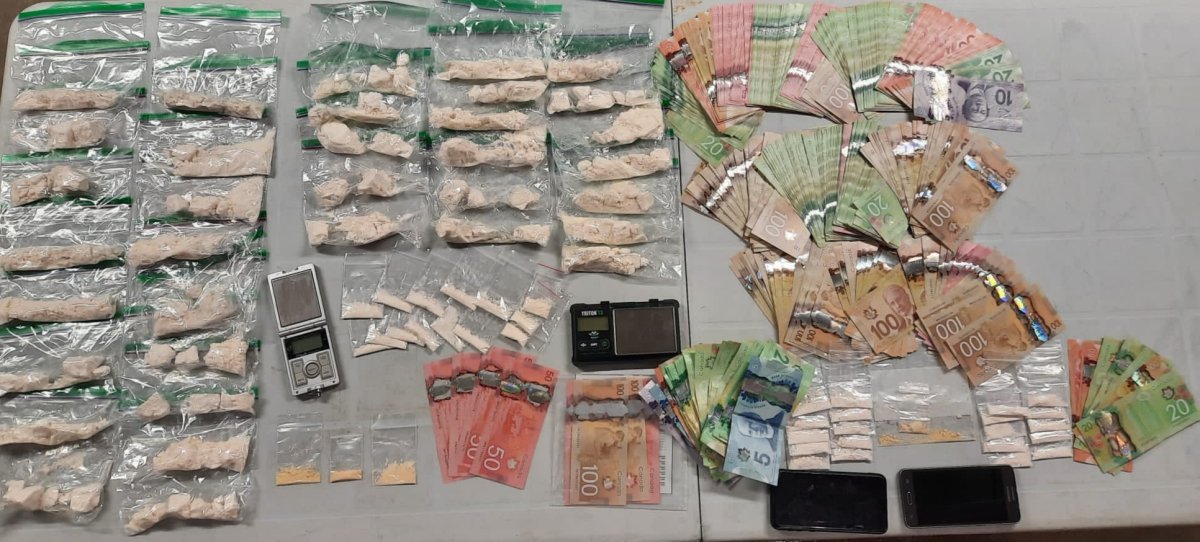 OPP street crime warrants led to a large drug and cash seizure at residences in Kingston and Elgin, Ontario. 