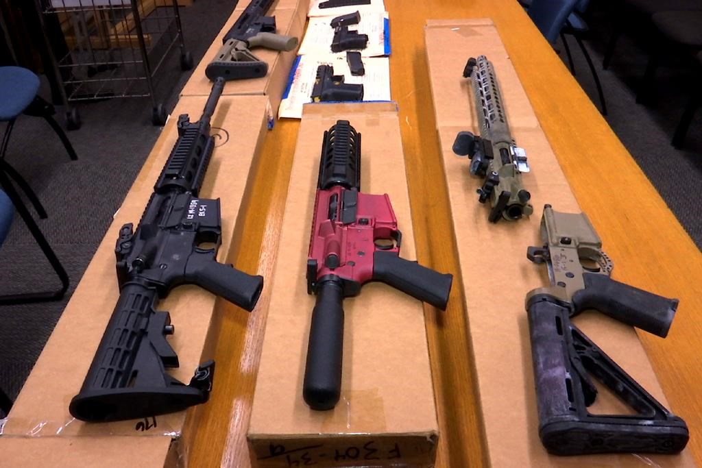 FILE - This Nov. 27, 2019, file photo shows "ghost guns" on display at the headquarters of the San Francisco Police Department in San Francisco. (AP Photo/Haven Daley, File).