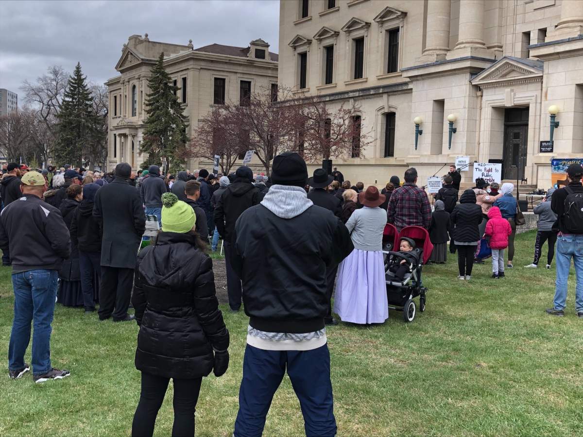 Manitoba Justice officials say four tickets were handed out at an anti-restrictions protest held outside the law courts in Winnipeg Monday.
