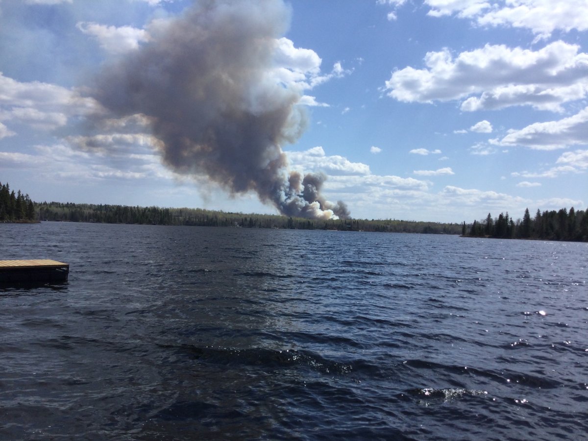 Crews were battling a wildfire in Manitoba's southern Whiteshell, near Falcon Lake, Wednesday.
