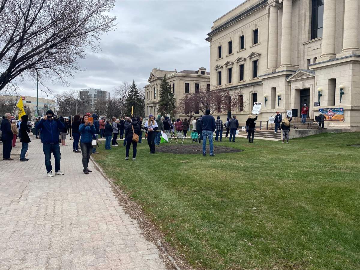 Anti-mask demonstrators at the Manitoba Law Courts building Monday.