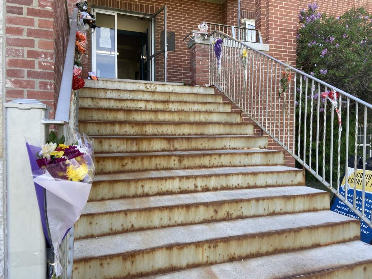 Flowers are tied along the steps of the former Old Sun residential school near Gleichen, Alta., pictured on May 31, 2021.
