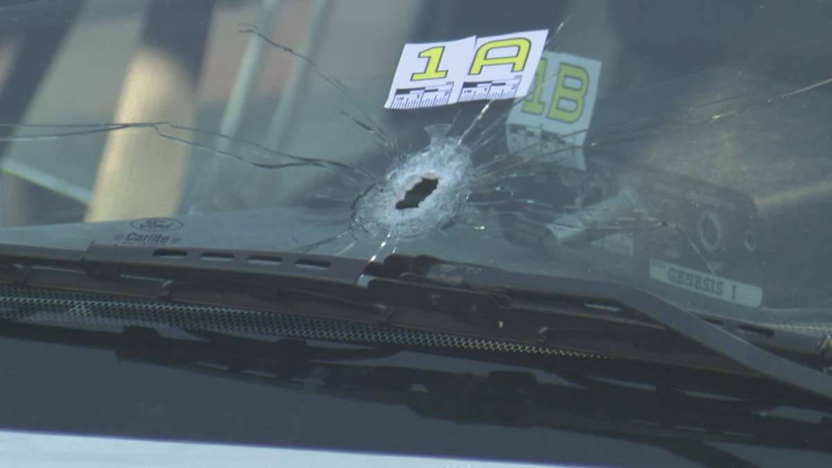 A bullet apparently fired from the suspect’s vehicle breaks the windshield of a Richmond RCMP cruiser. Global News