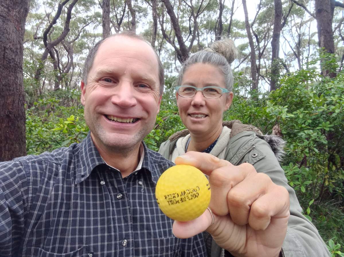 Robert Annesley in Australia, holding a golf ball from Cougar Creek Golf Resort in Parkland County, Alta.
