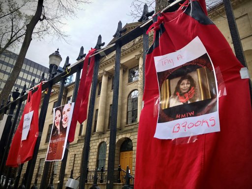 Red dresses hang outside of Province House in Halifax on Red Dress Day, May 5, 2021.