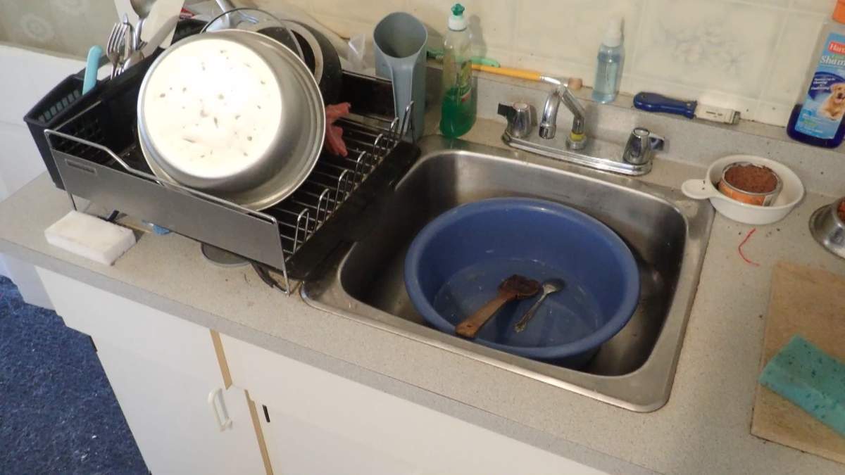 Maria Mielczarek and her husband collect their wastewater and typically dump it in the yard. After a sewer line into the house was damaged, most of the water ends up in their basement.