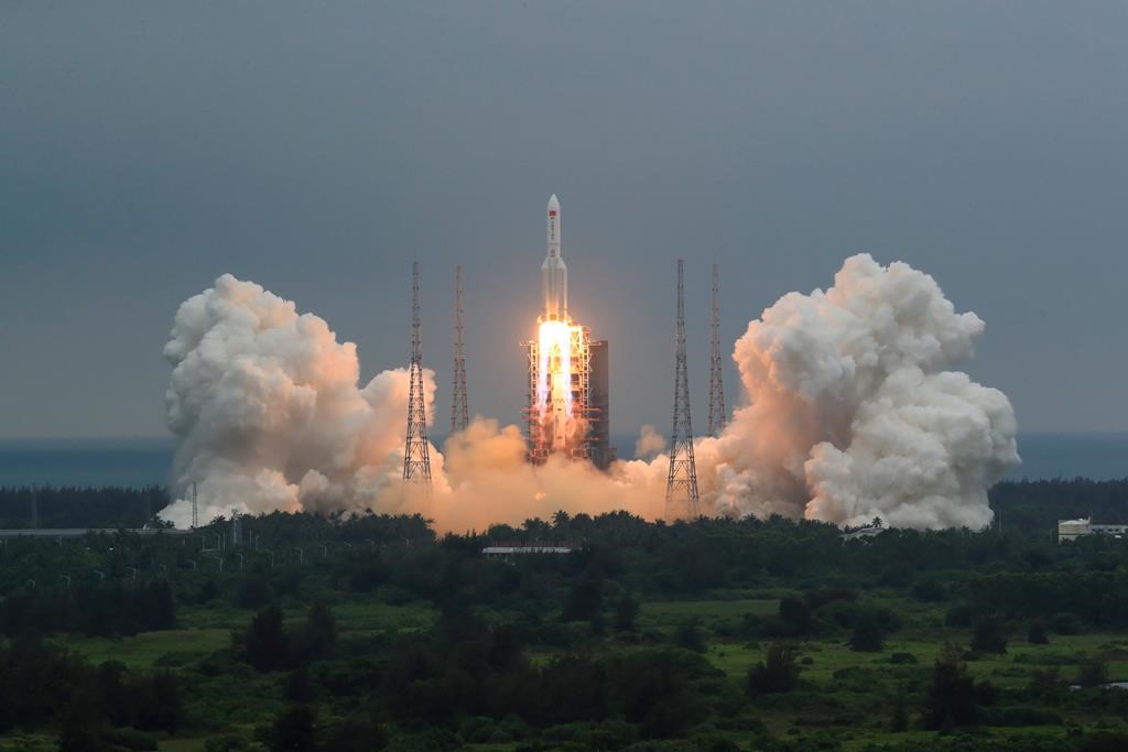 FILE - In this April 29, 2021, file photo released by China's Xinhua News Agency, a Long March 5B rocket carrying a module for a Chinese space station lifts off from the Wenchang Spacecraft Launch Site in Wenchang in southern China's Hainan Province.