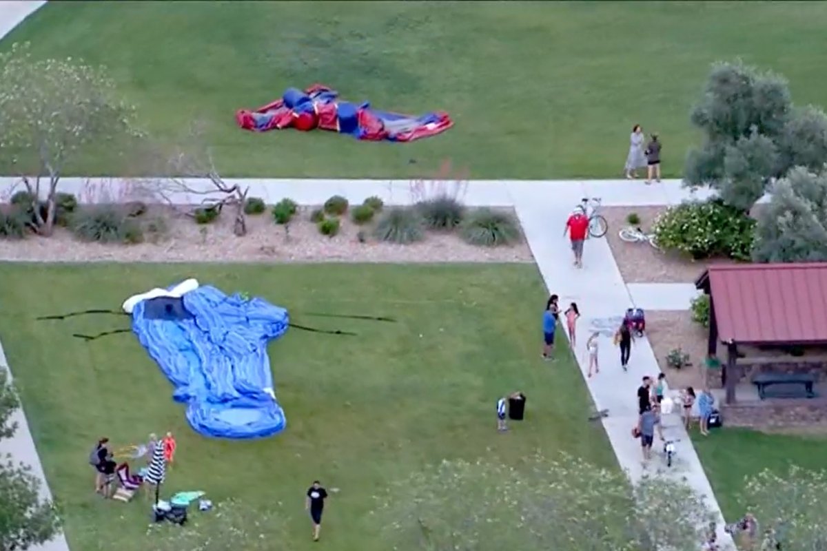 Deflated bouncy castles are shown at the site of a wind-related accident in Mesa, Ariz., on May 20, 2021.