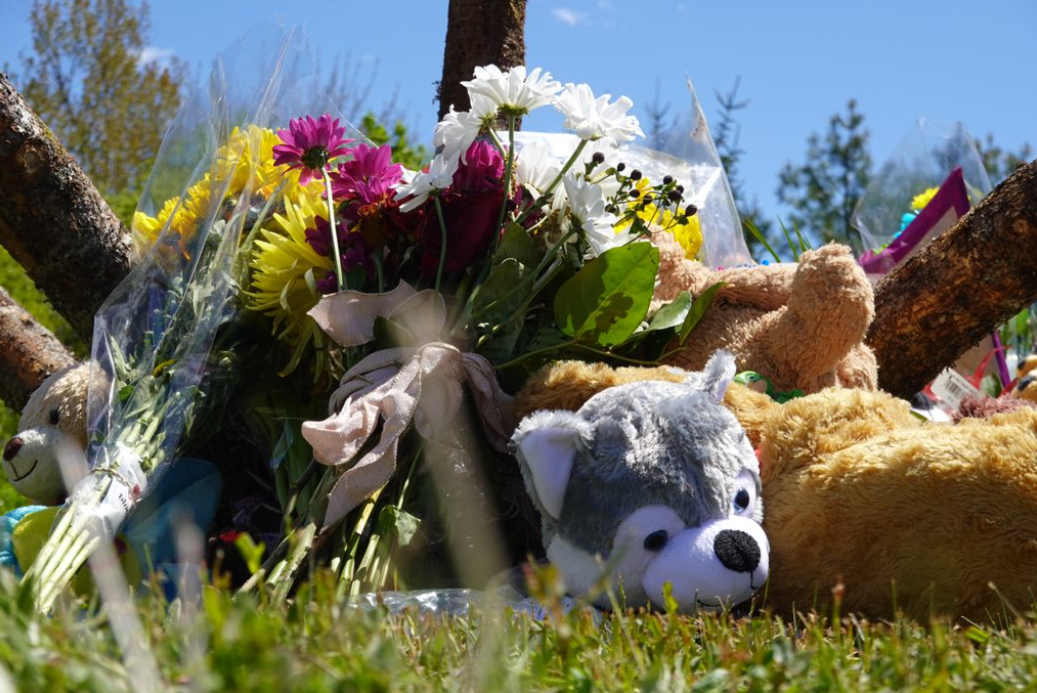 People set up a small memorial at the site where a 5-year-old boy was killed in a car crash.