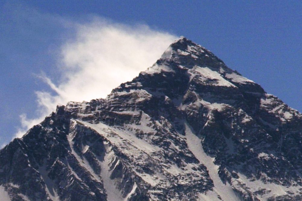 Clouds move from Nepal around Mount Everest Himalayas in Tibet. 