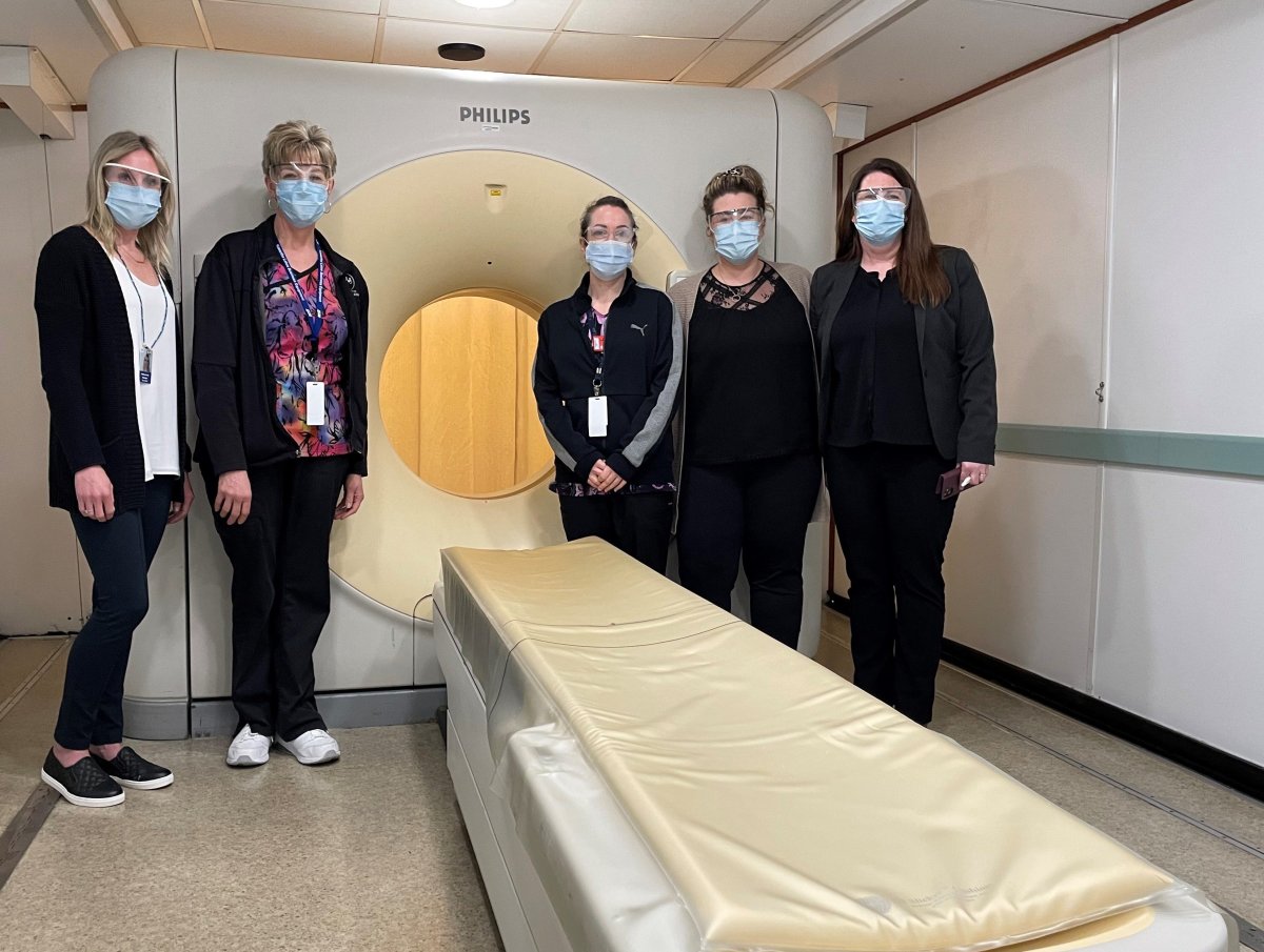 Ross Memorial Hospital’s Mallory Louws, manager of diagnostics, Colleen Patton, senior CT Technologist, Brooke Mansfield, senior CT Technologist, Cynthia Suarez, PACS Administrator, and Gail Kennedy, director of diagnostic imaging, inside the newly arrived mobile CT scanner on Tuesday, May 4, 2021.
