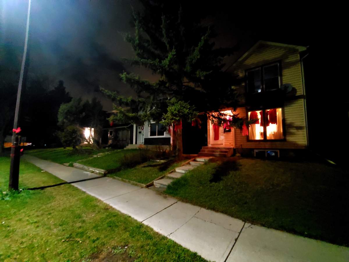 Red dresses hang in a Calgary home.