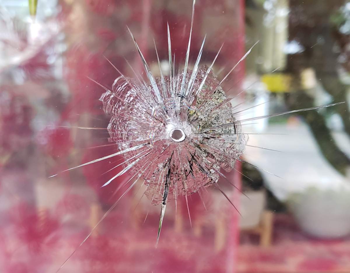Damage to the window of Posno Flowers, as seen earlier this week.