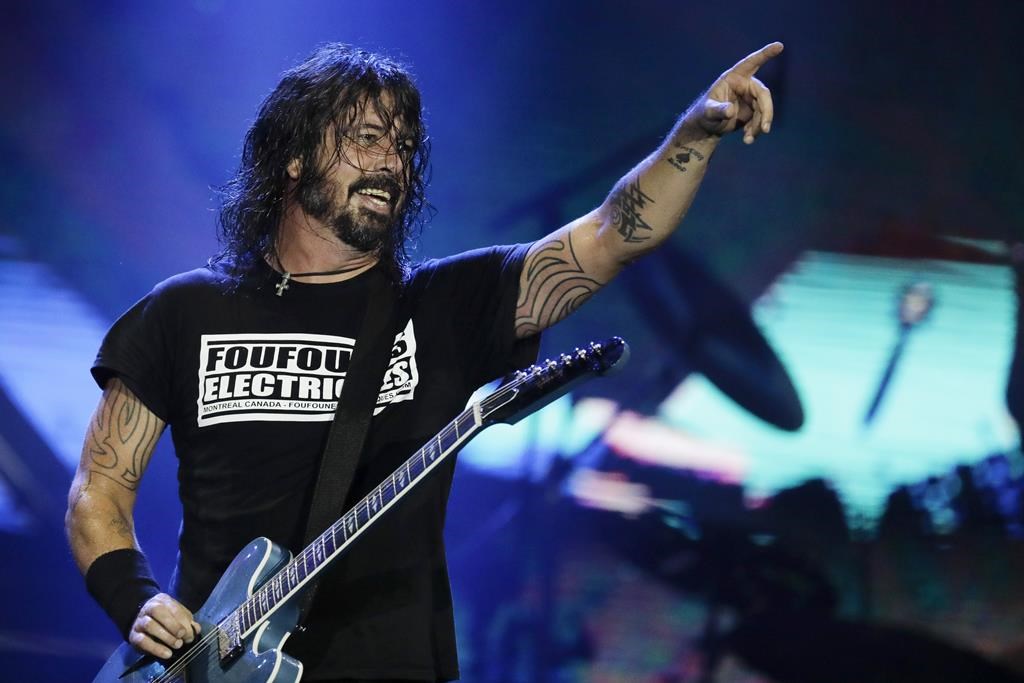 FILE - In this Sept. 29, 2019, file photo, Dave Grohl of the band Foo Fighters performs at the Rock in Rio music festival in Rio de Janeiro, Brazil. The band will perform at Madison Square Garden on June 20. (AP Photo/Leo Correa, File).