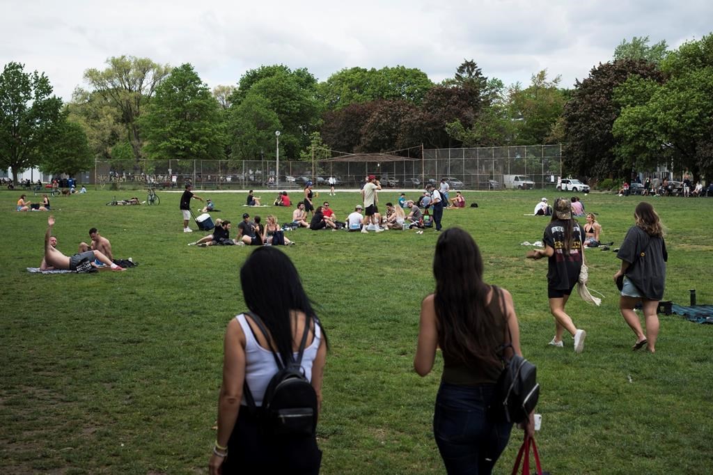 People gather at Trinity Bellwoods Park in Toronto at the start of the May long weekend on Saturday, May 22, 2021.