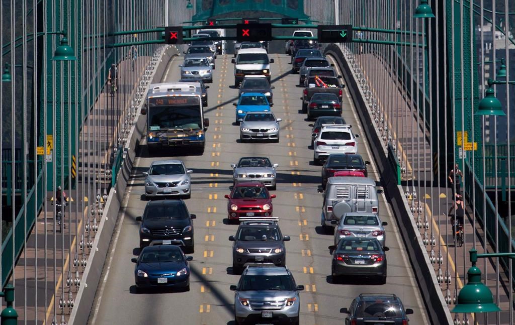 Traffic crosses over the Lions Gate Bridge from North Vancouver into Vancouver, B.C., on Thursday July 2, 2015. 