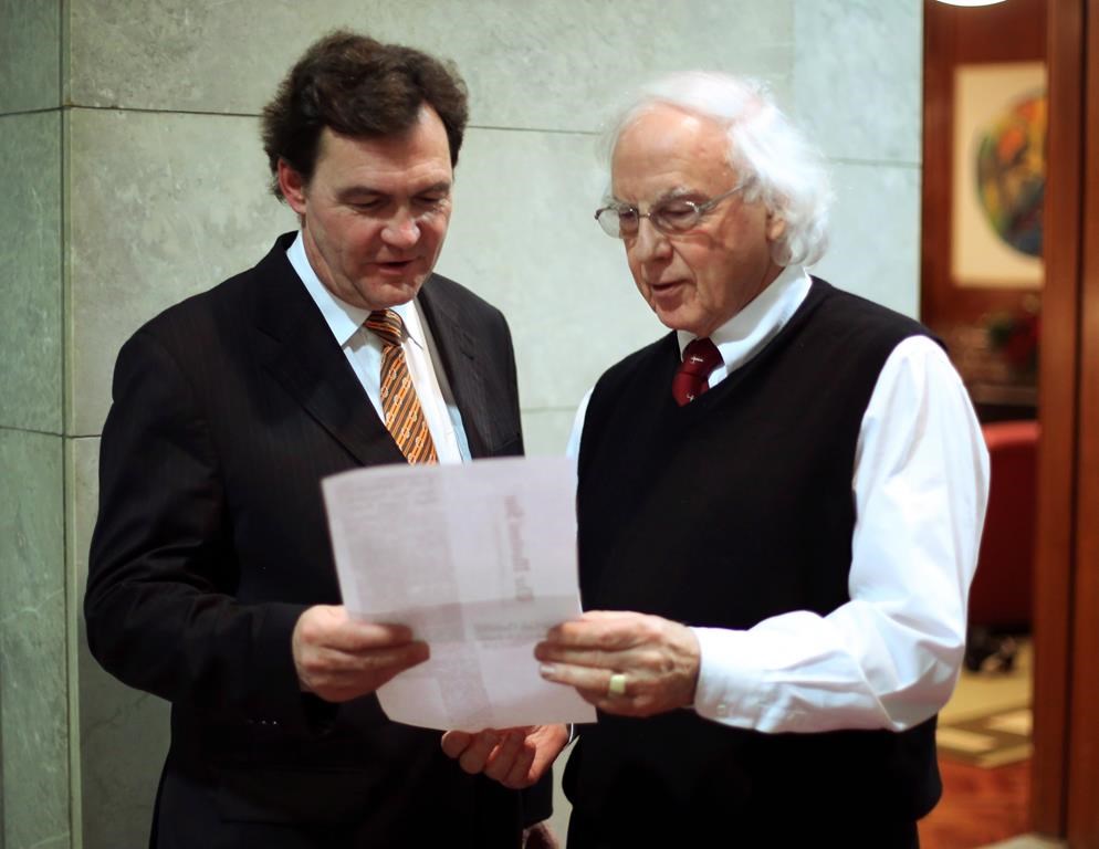 Federal Supreme Court Justice, Richard Wagner (left) confers with his colleague Supreme Court Justice Morris Fish in Ottawa, Monday December 10 2012. Fish is calling for urgent reforms to Canada's military justice system to prevent victims of misconduct, sexual and otherwise, from continuing to suffer. THE CANADIAN PRESS/Fred Chartrand.