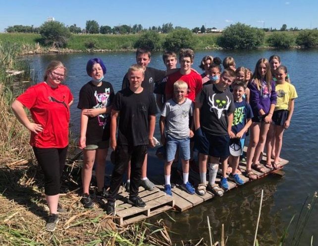Grade 7 and 8 students at Lucky Lake School pose for a photo before sinking the Titanic replica at a nearby reservoir.