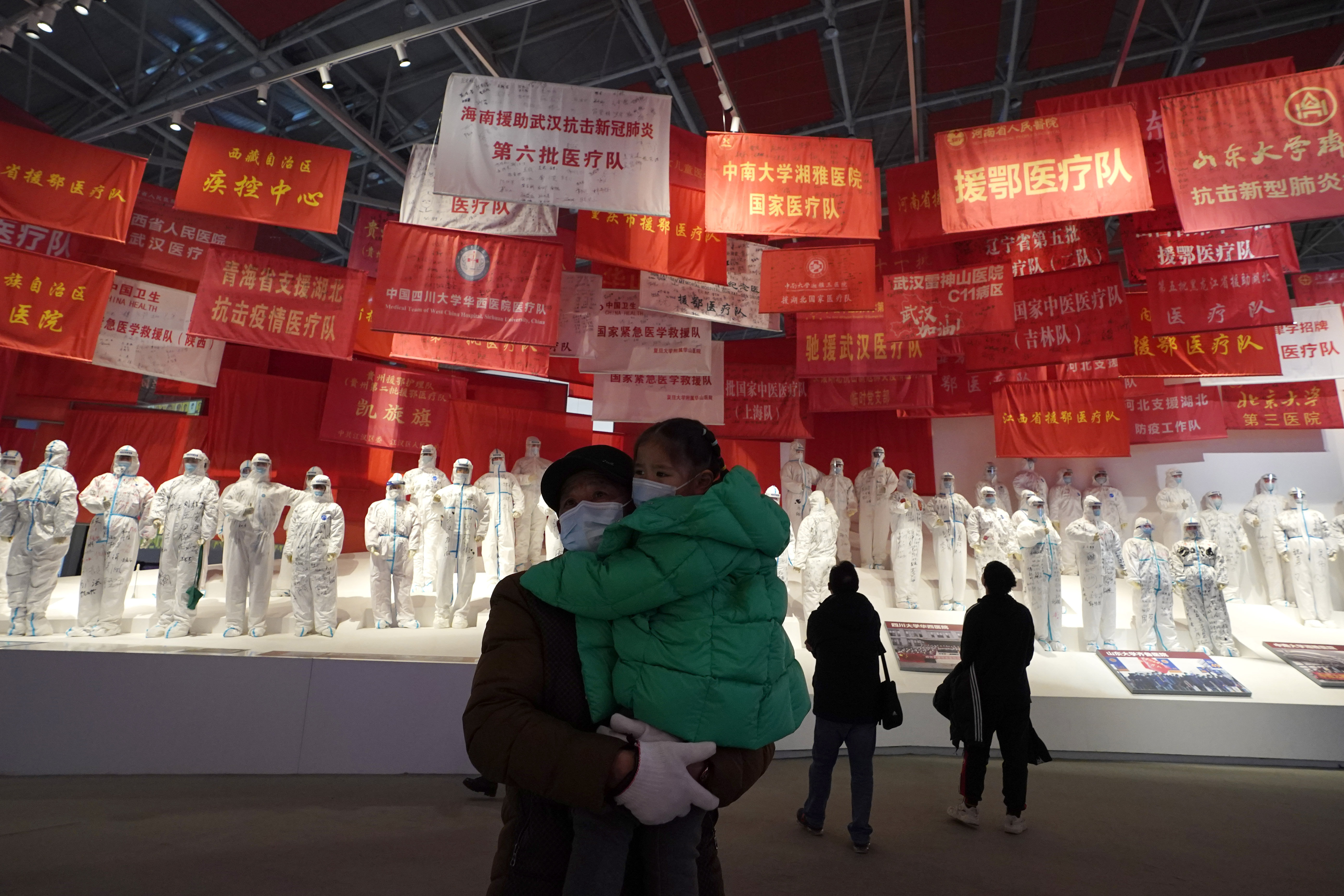 Residents attend an exhibition on the city’s fight against the coronavirus in Wuhan in central China’s Hubei province, Saturday, Jan. 23, 2021.  (AP Photo/Ng Han Guan)