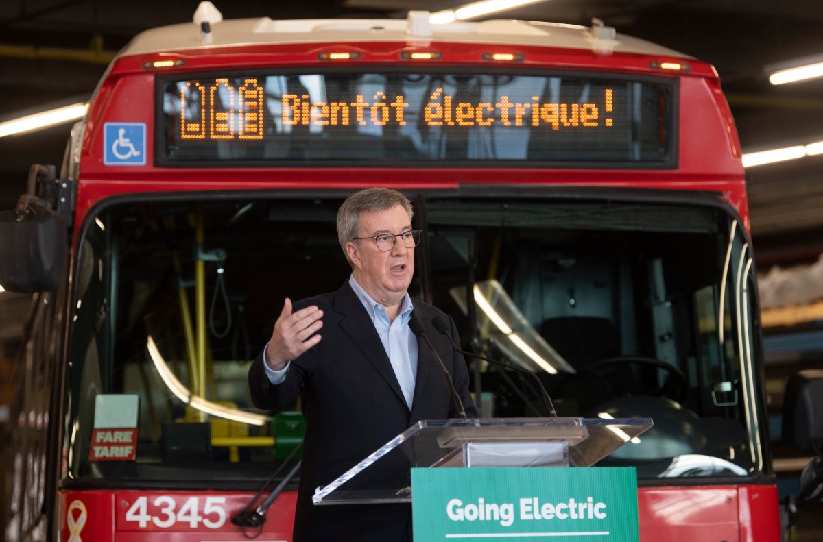 Ottawa Mayor Jim Watson speaks during an announcement at a public transit garage in Ottawa, Thursday March 4, 2021. The city's transit commission approved an electric bus transition plan at its meeting on Wednesday.