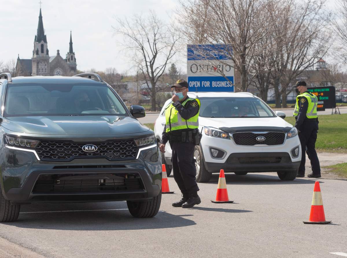 Ontario Provincial Police check travellers entering Ontario from Quebec as new COVID-19 measures take effect Monday, April 19, 2021  in Hawkesbury, Ontario. 