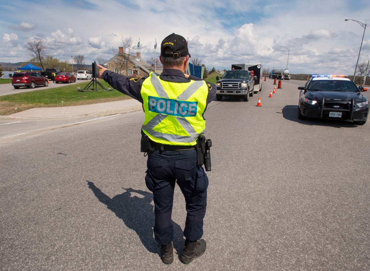 Ontario Provincial Police check travellers entering Ontario from Quebec  in Hawkesbury, Ont. 