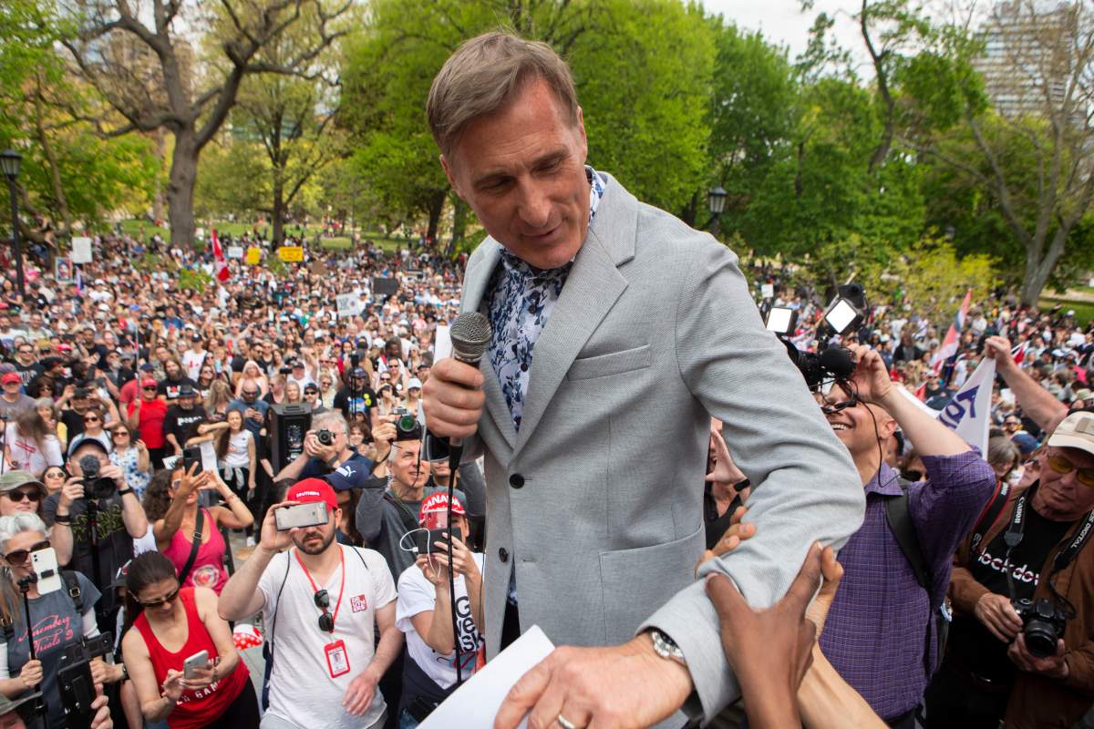 Maxime Bernier, Leader of the People's Party of Canada prepares to speak to the crowd as protesters demonstrate against measures taken by government and public health authorities to curb the spread of COVID-19, in Toronto, Saturday, May 15, 2021. Bernier was arrested in Manitoba Friday, June 11, 2021 for violating public health orders.