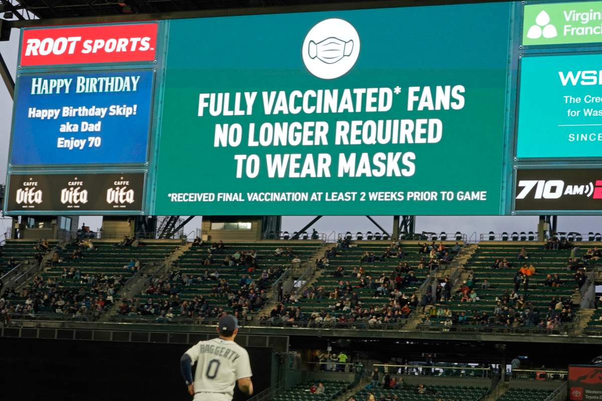 Fans sit in a special section for people who are fully vaccinated against COVID-19, at T-Mobile Park during a baseball game between the Seattle Mariners and the Detroit Tigers, Monday, May 17, 2021, in Seattle. (AP Photo/Ted S. Warren)