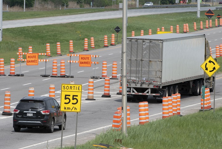 Traffic is detoured off of highway 40 eastbound in Vaudreuil-Dorion, west of Montreal as the Ile-aux-Tourtes bridge on Highway 40 was closed, in Montreal, Friday, May 21, 2021.