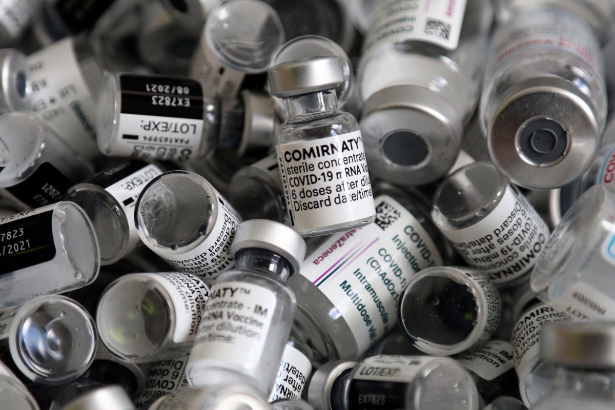 FILE - In this Saturday, May 15, 2021, file photo, empty vials of the Pfizer COVID-19 vaccine lie in a box during a vaccine campaign in Ebersberg near Munich, Germany.