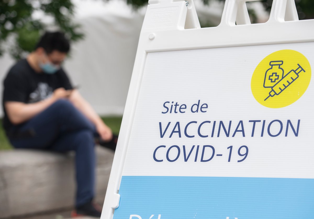 A man is shown outside a COVID-19 vaccination site in Montreal, Saturday, June 5, 2021, as the COVID-19 pandemic continues in Canada and around the world. 