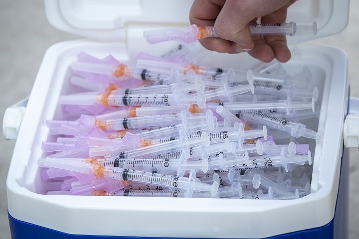 A cooler full of syringes with Moderna COVID-19 vaccine before a drive-thru vaccine clinic in Kingston, Ontario on Friday June 4, 2021.