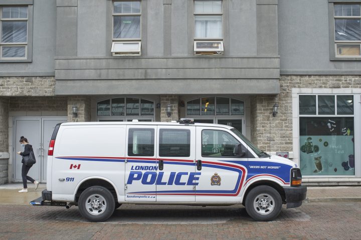A police van sits outside of an address in London, Ont., linked to Nathaniel Veltman, the suspect in the murder of four members of a Muslim family. June 8, 2021. The address is THE CANADIAN PRESS/ Geoff Robins
