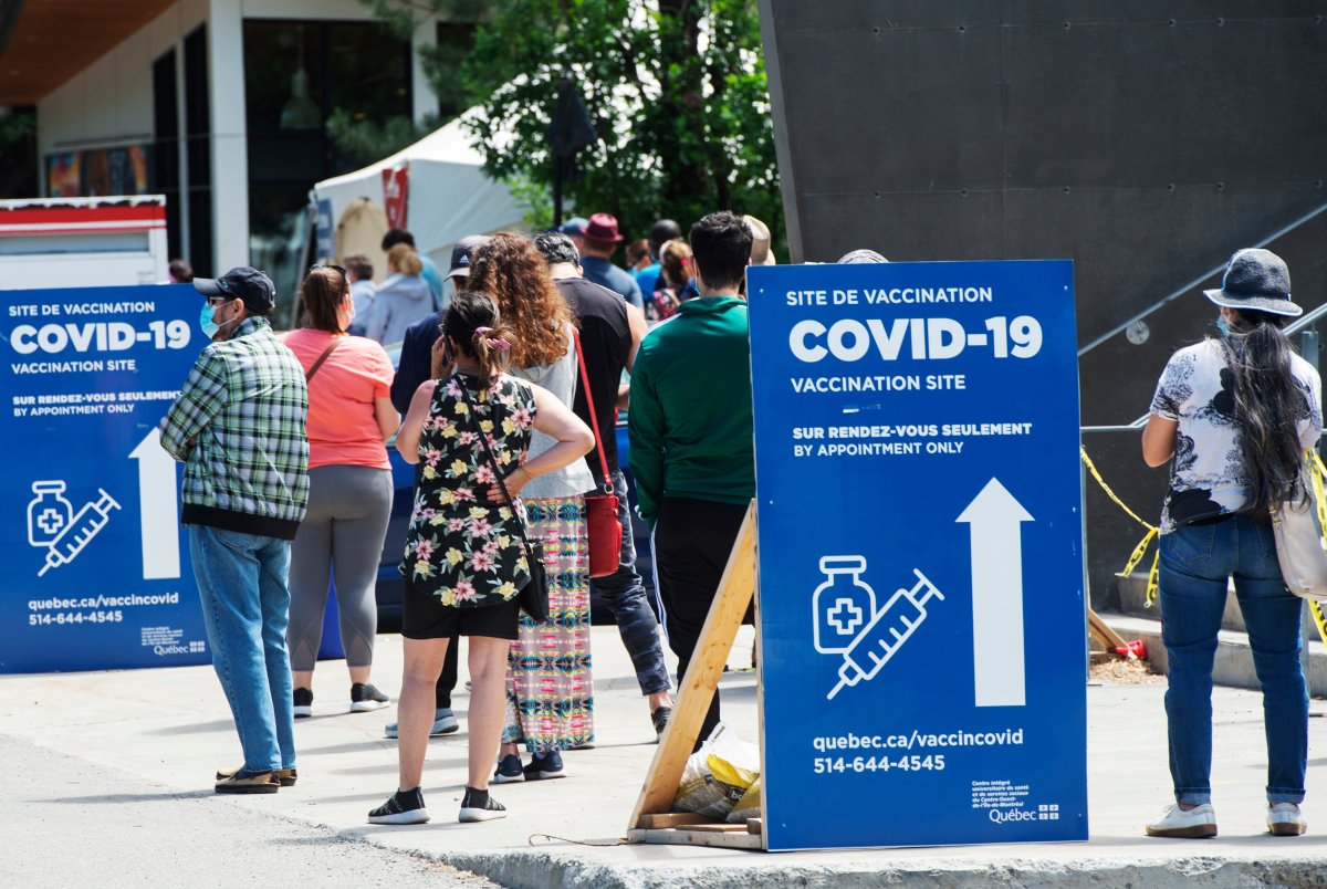 People line up to get their COVID-19 vaccine at a vaccination centre, Thursday, June 10, 2021  in Montreal. 
