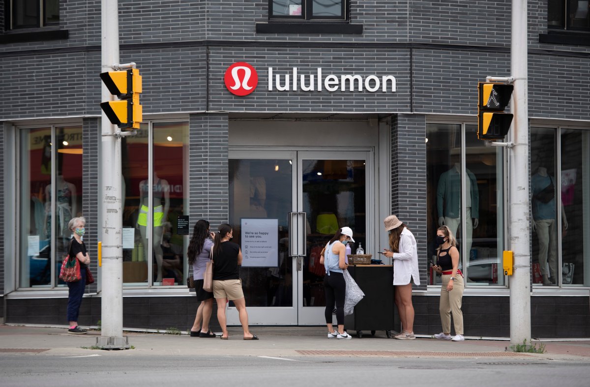 People line up outside a Lululemon Athletica store in Ottawa, as non-essential retail stores re-open with limited in-store capacity, on the first day of Ontario's first phase of re-opening amidst the third wave of the COVID-19 pandemic, on Friday, June 11, 2021. 