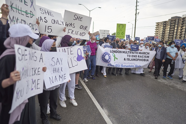 Local faith leaders stand at the front of a march calling to end Islamophobia in London, Ont., on June 11.