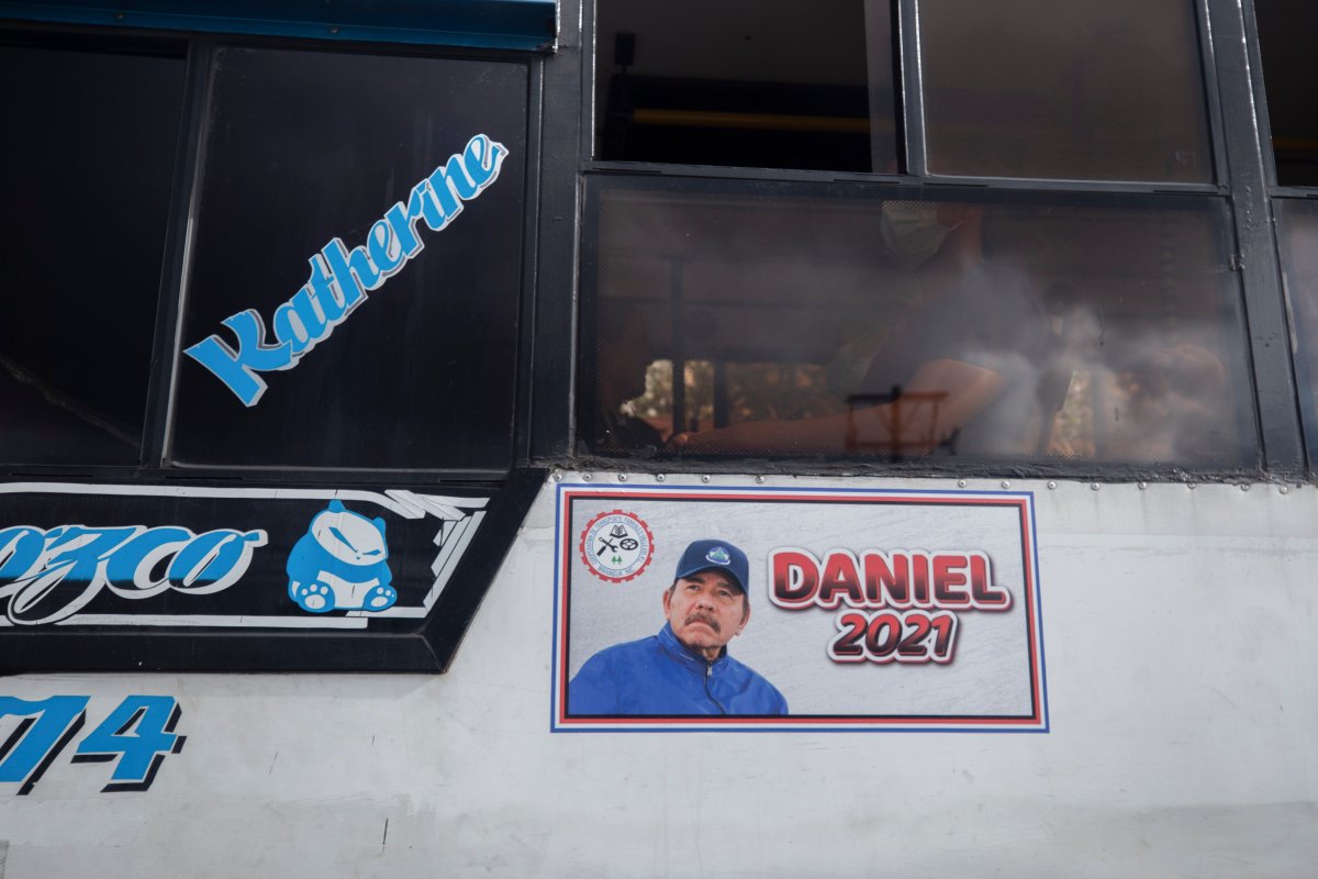 A poster promotes presidential candiate and current President Daniel Ortega on the side of a bus, in Managua, Nicaragua, Thursday, June 17, 2021. In recent weeks, Nicaragua President Daniel Ortega's government has rounded up 13 opposition leaders, including four presidential challengers for the Nov. 7 elections. They face allegations ranging from money laundering to crimes against the state. (AP Photo/Miguel Andres).