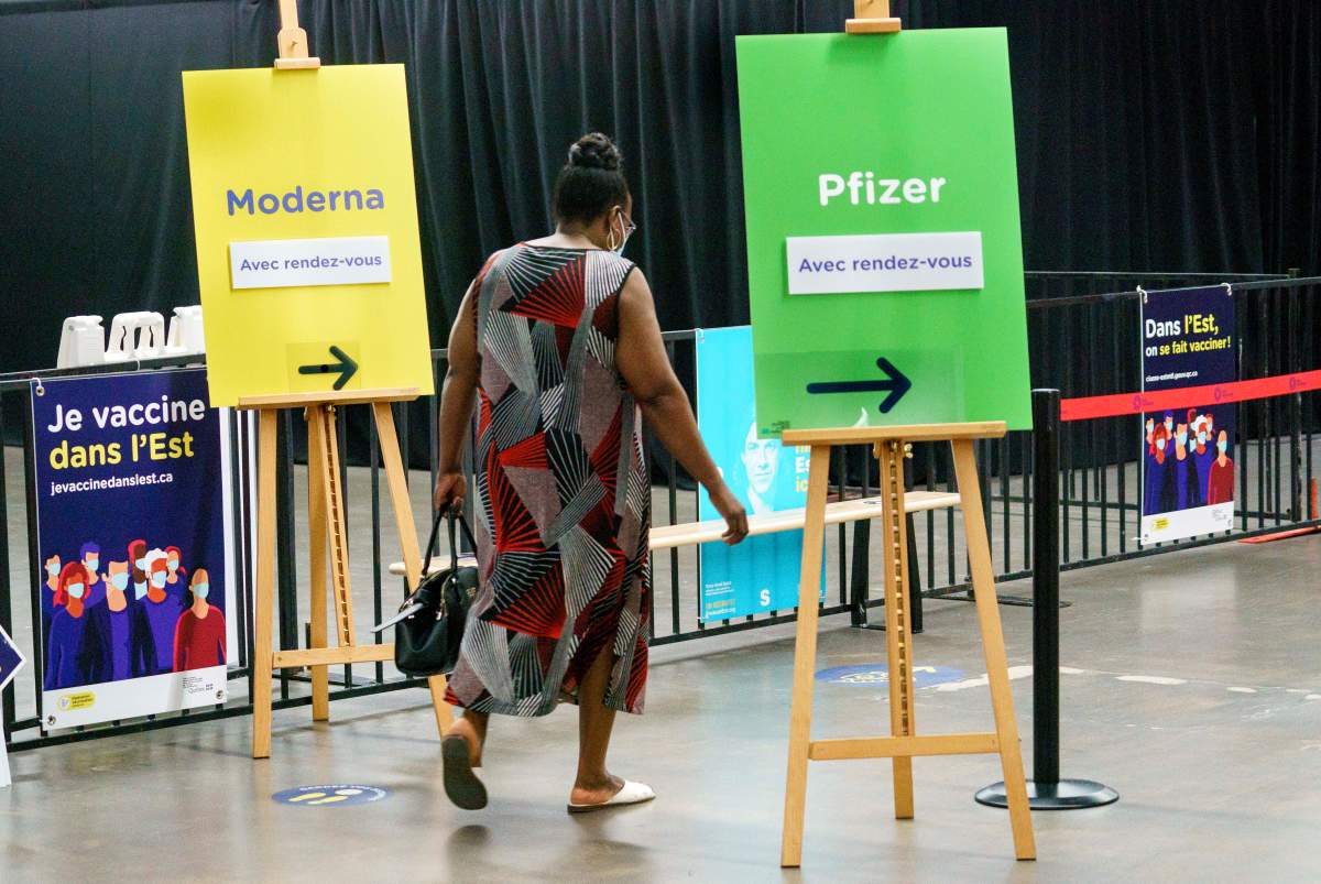 A woman arrives at a COVID-19 vaccination clinic in Montreal, on Monday, June 21, 2021. 